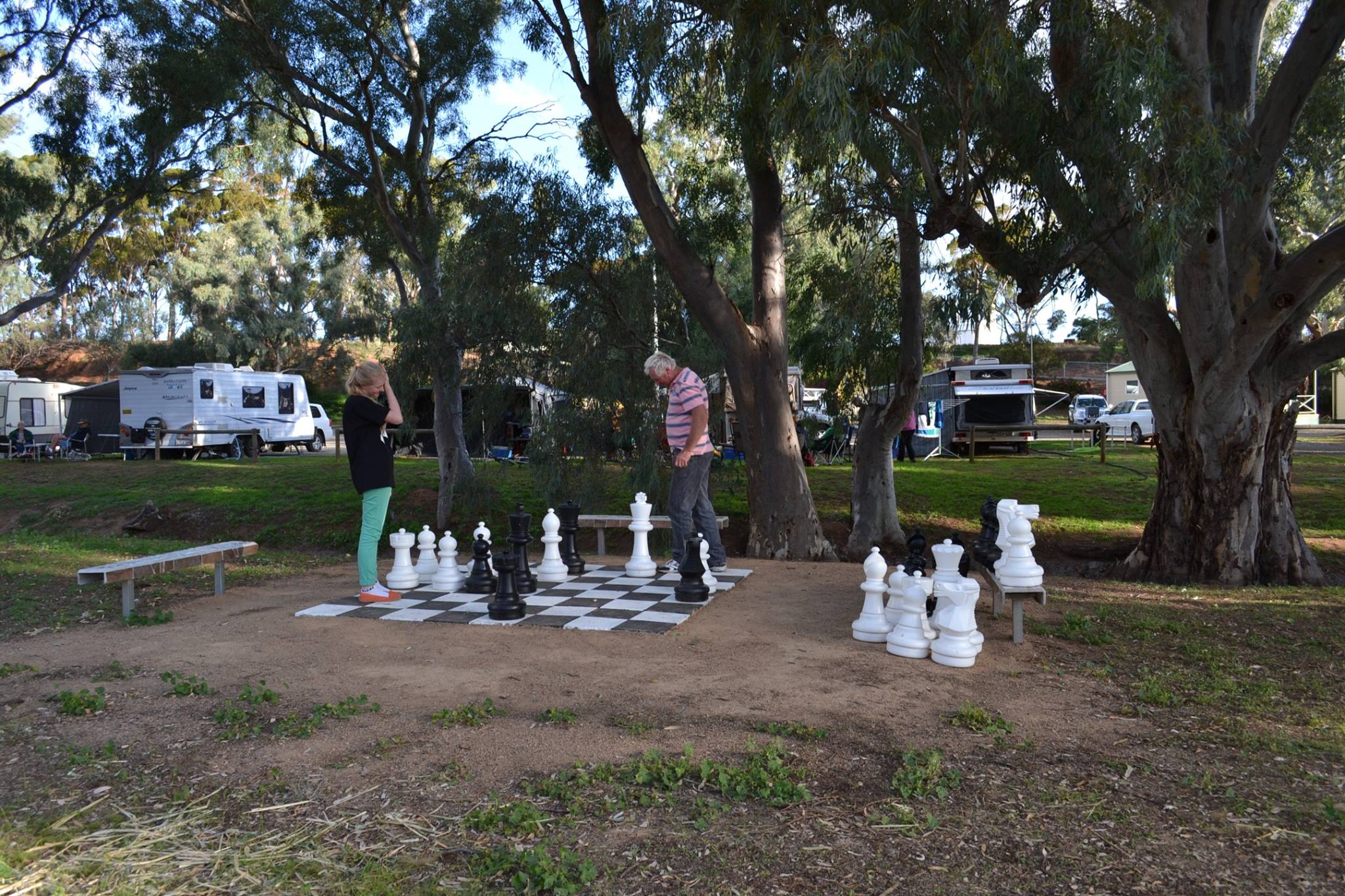 People playing a giant game of chess